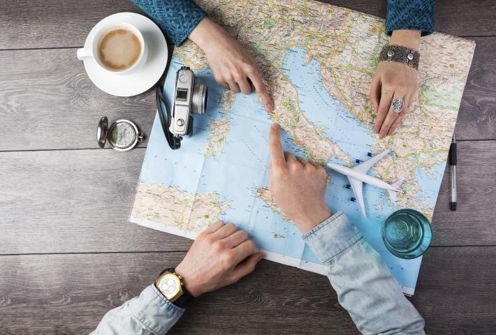 People mapping out travel plans